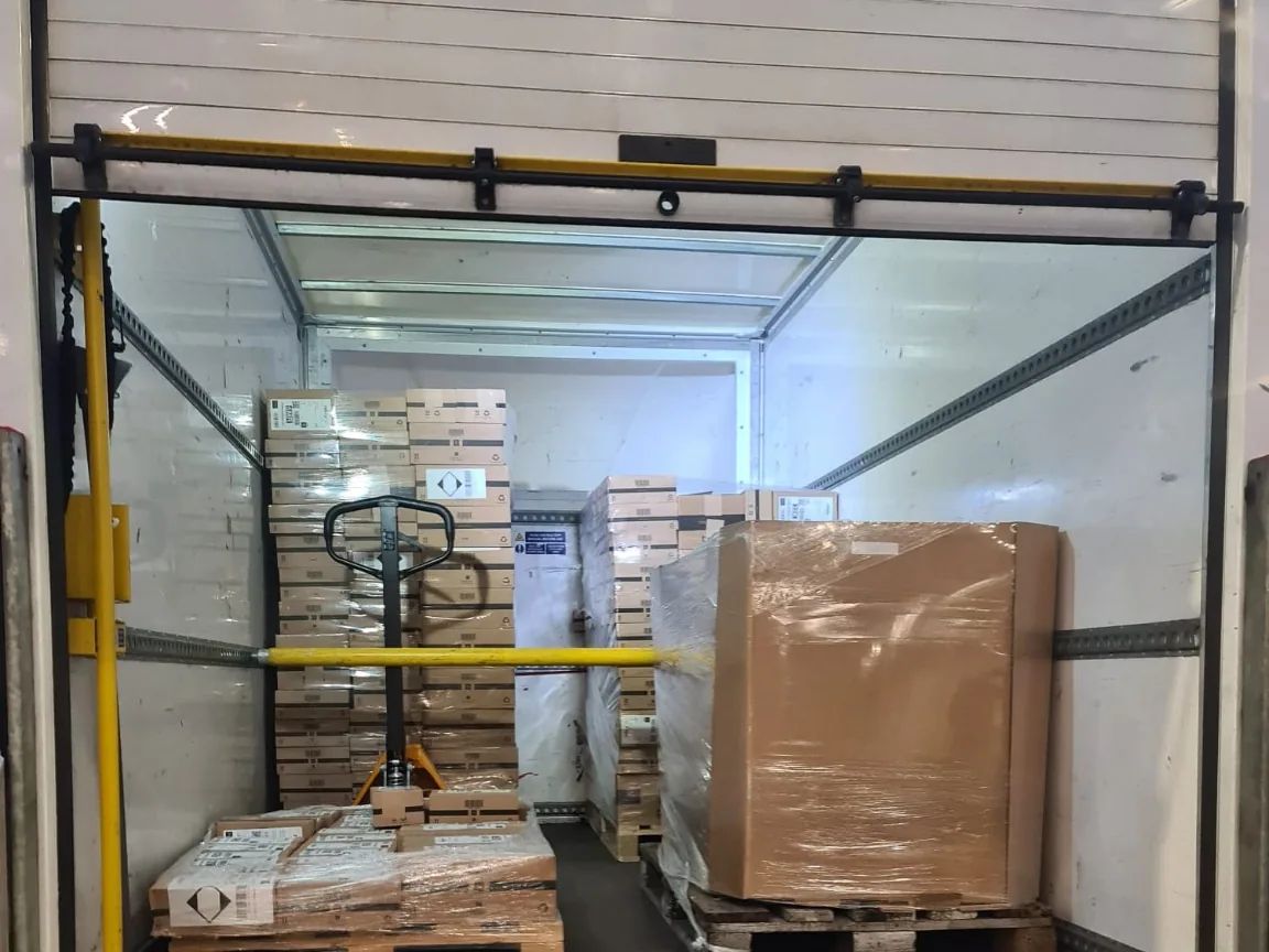 Palletised commercial goods loaded securely in a Luton van