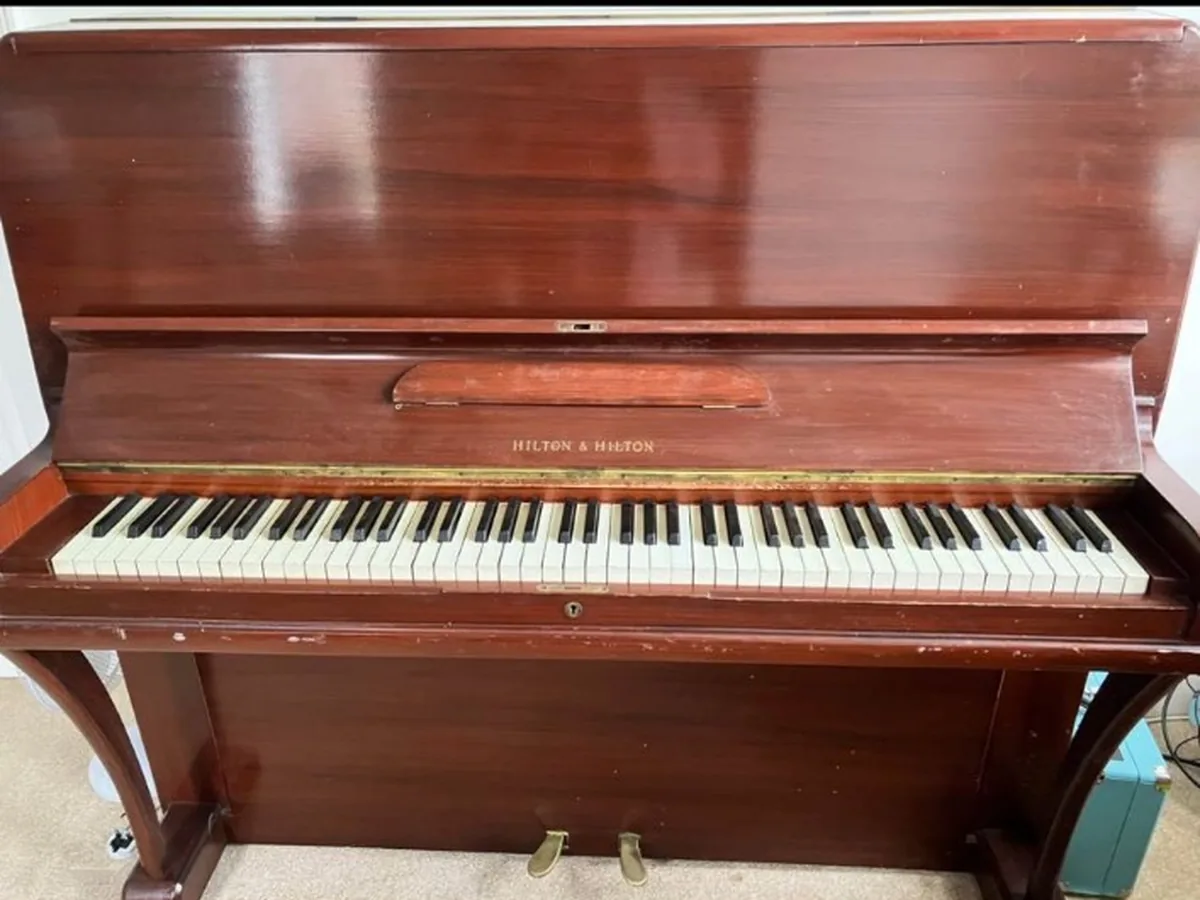Upright piano prepared for a specialist removal assessment