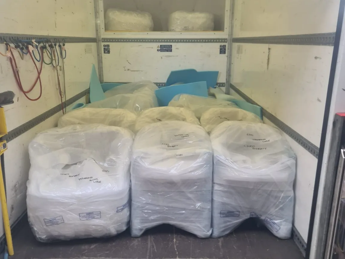 Wrapped commercial goods secured on pallets